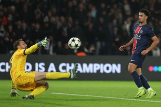 Paris Saint-Germain's French midfielder #33 Warren Zaire-Emery (R) scores his team's first goal during the UEFA Champions League, League phase - Matchday 4, football match between Paris Saint-Germain (PSG) and Atletico Madrid, at the Parc des Princes stadium in Paris on November 6, 2024.