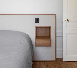 a built in headboard with floating nightstands