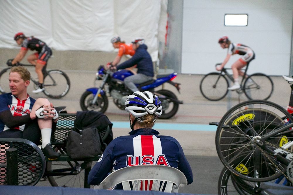Riders wait their turn in the paddock as other work out on the track