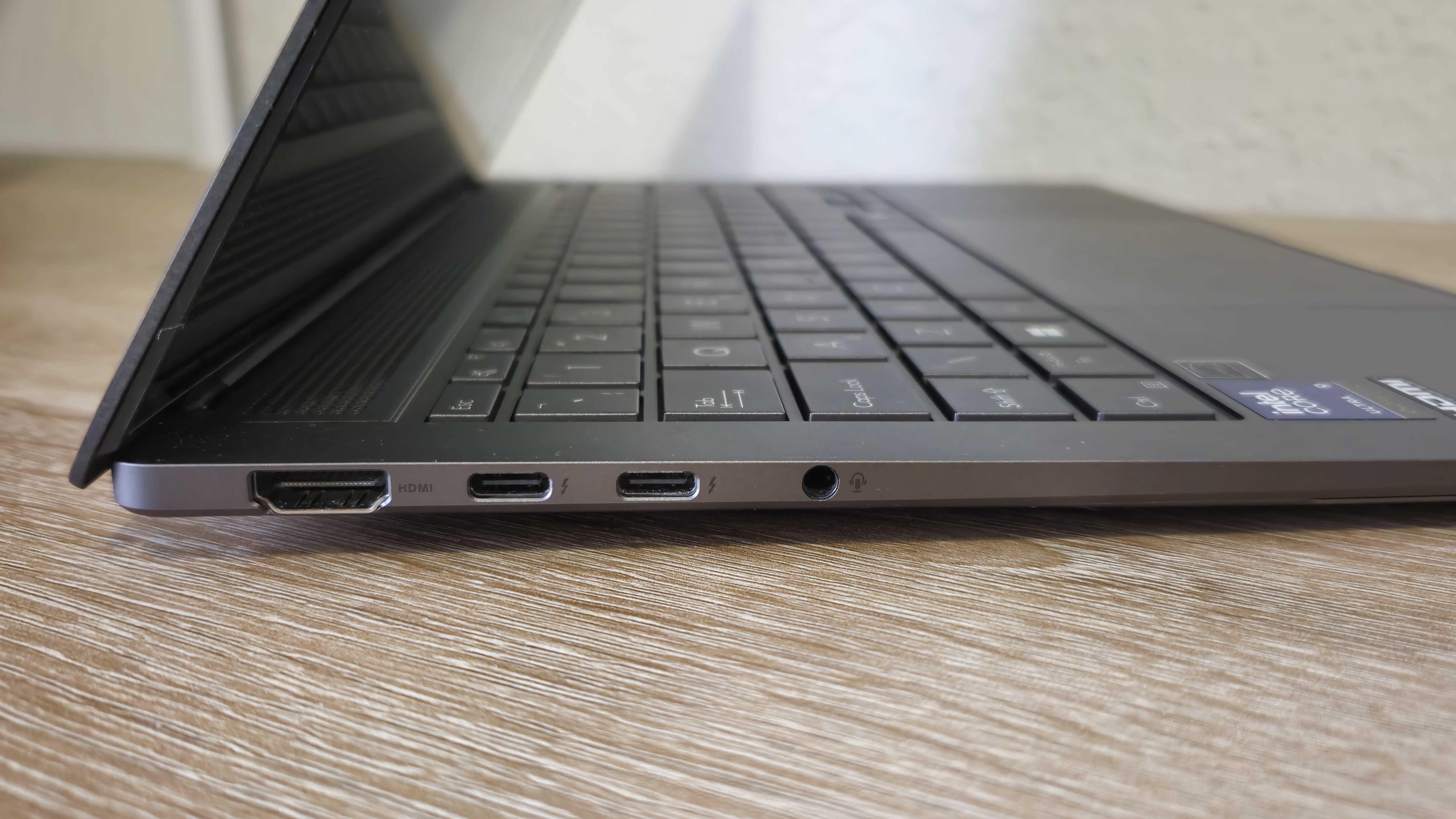 The Asus Zenbook S 14 viewed from the side to show off its HDMI, USB-C, and audio jack ports