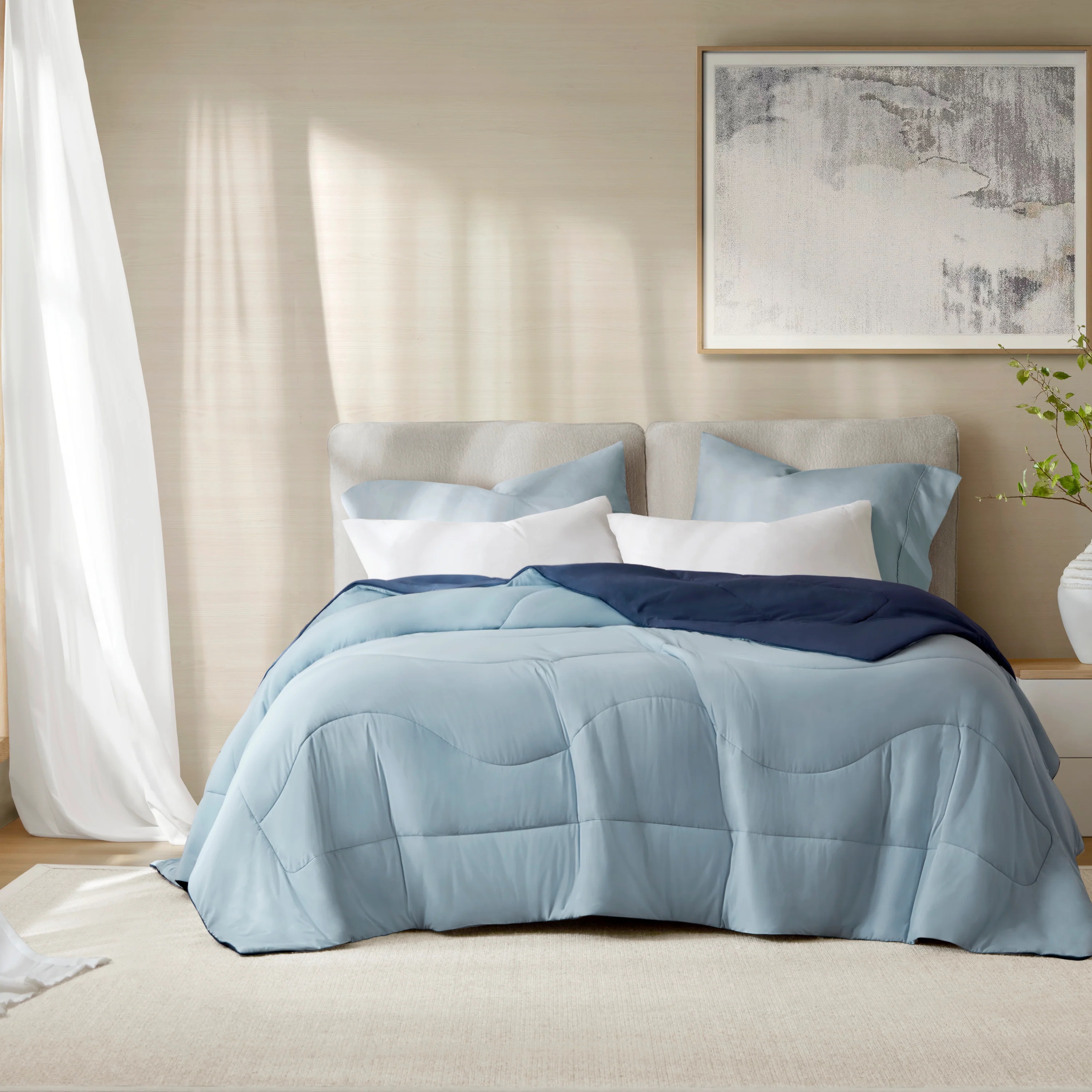 A blue reversible Harbor House comforter