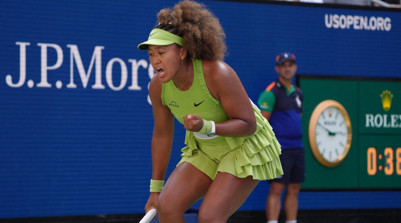 Naomi Osaka celebrates winning a point against Latvia&#039;s Jelena Ostapenko during their women&#039;s singles first round match on day two of the US Open tennis tournament at the USTA Billie Jean King National Tennis Center in New York City, on August 27, 2024.