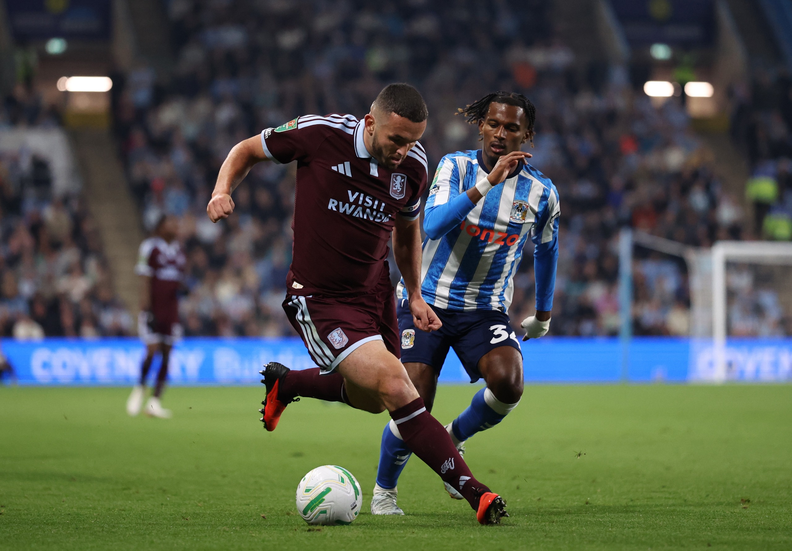 Aston Villa captain John McGinn and Yann Gboho of Coventry City