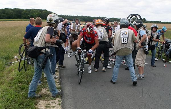 Fabian Cancellara (Team Saxo Bank) gets back on his bike following a crash.