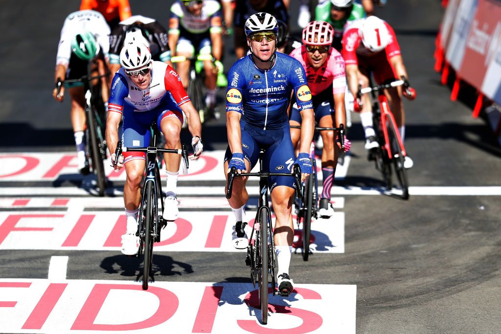 MOLINA DE ARAGON SPAIN AUGUST 17 Fabio Jakobsen of Netherlands and Team Deceuninck QuickStep celebrates winning stage ahead of Arnaud Demare of France and Team Groupama FDJ and Magnus Cort Nielsen of Denmark and Team EF Education Nippo during the 76th Tour of Spain 2021 Stage 4 a 1639km stage from El Burgo de Osma to Molina de Aragn 1134m lavuelta LaVuelta21 on August 17 2021 in Molina de Aragn Spain Photo by Gonzalo Arroyo MorenoGetty Images