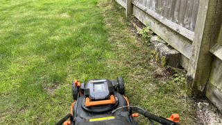 edge cutting on the WORX WG743E Cordless Lawnmower