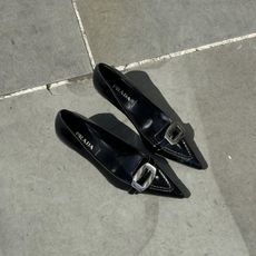 a pair of prada black vintage buckle heels from serotonin vintage in london