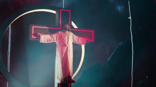 Lil Dicky poses like Jesus on the cross on Dave