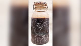 Trapper cabin oil in a Ball jar.