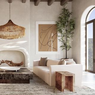 A white sofa in a lake house-style living room from Banana Republic