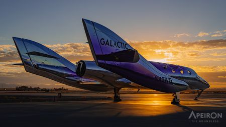 A shiny purple space plane stands on a runway slightly silhouetted by a setting sun.