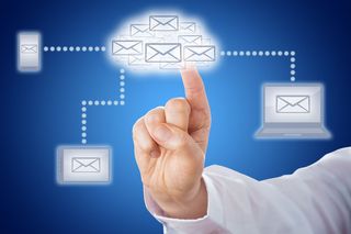 Hand pointing to email in the cloud