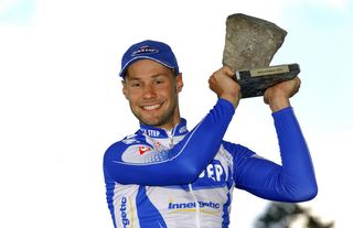 Tom Boonen proudly shows off his first Paris-Roubaix cobble in 2005