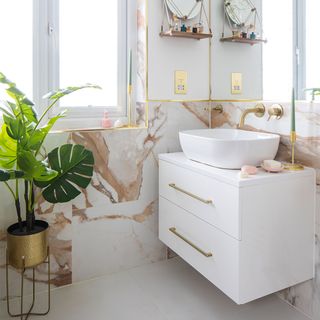 marble and white bathroom with basin and vanity unit