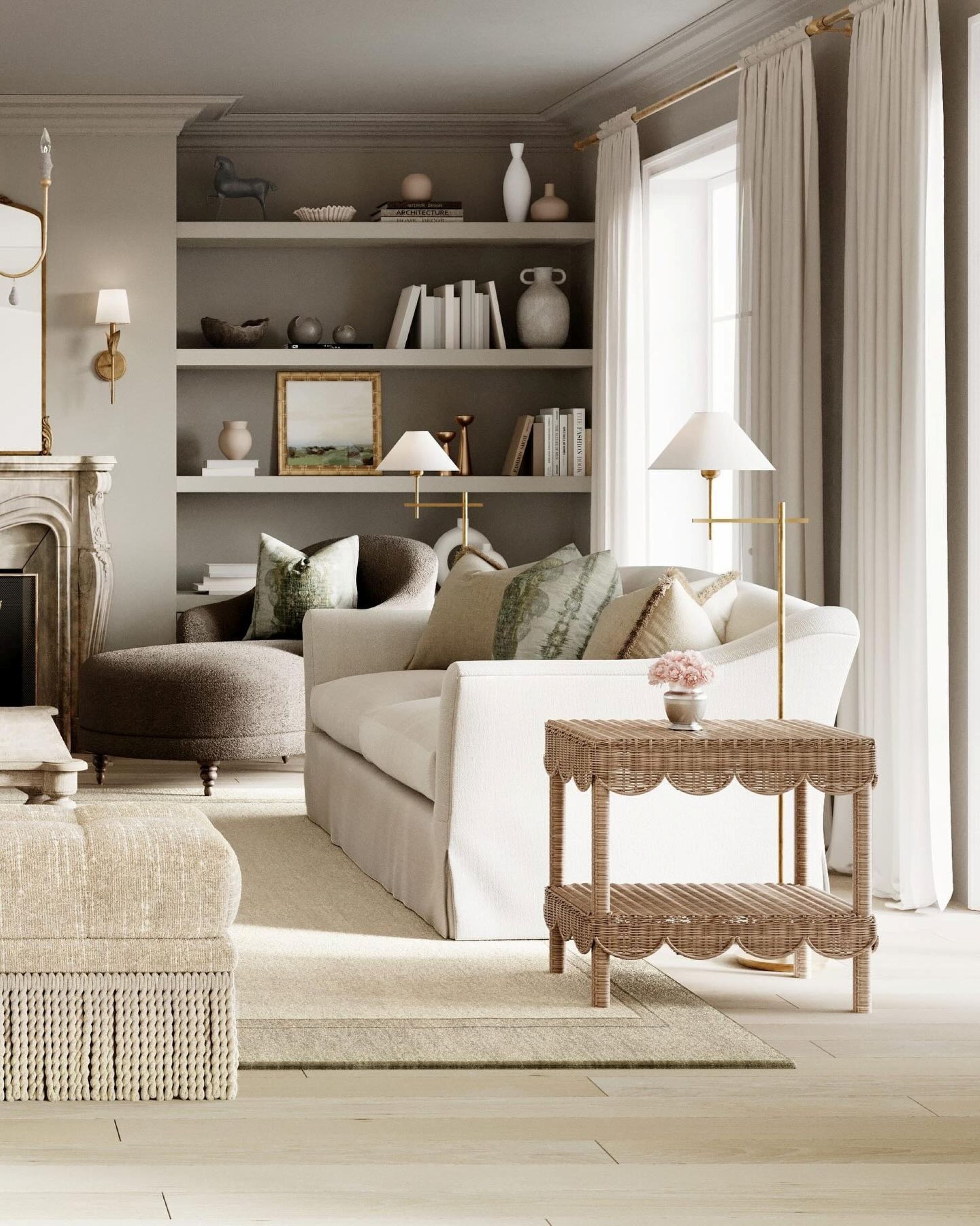 a living room with taupe walls, a built in shelf filled with decor, a white sofa, a rattan side table, and gold accent details