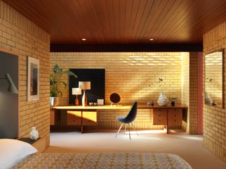 The master bedroom, with an original dressing table and a headboard