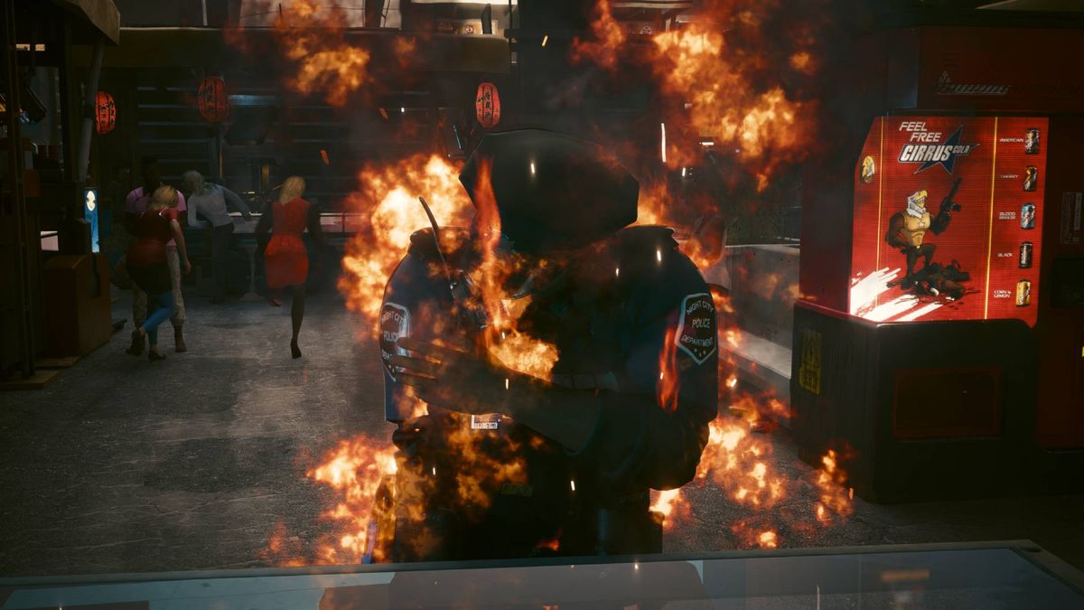 A police officer in Cyberpunk 2077 on fire due to the overheat quickhack.