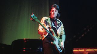 Paul McCartney performs live on stage with Wings at Ahoy on 25th March 1976 in Rotterdam, Netherlands. He plays a Rickenbacker 4001S bass guitar