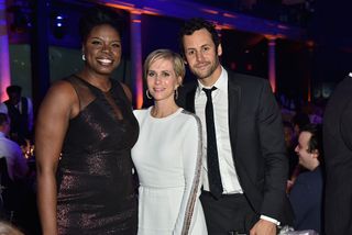 Kristen Wiig poses with Leslie Jones and partner Avi Rothman, with whom she shares two children.