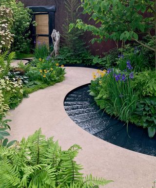 black water feature in the boodles travel garden at chelsea flower show 2022