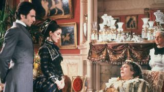 Daniel Day-Lewis, Winona Ryder and Miriam Margolyes in an opulent room in The Age of Innocence.