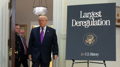 Donald Trump arrives in the Roosevelt Room of the White House to announce environmental deregulations.