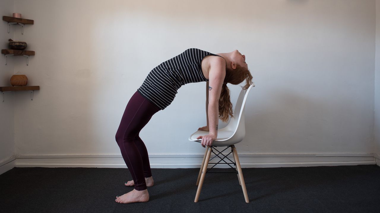 desk exercises: woman in backbend, using the chair as a support