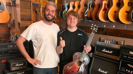 Lewis Capaldi with a vintage Gibson (right) standing next to Play Vintage store owner Andrew Francica