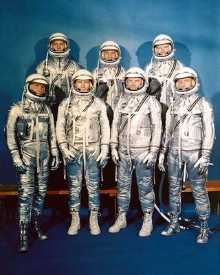 Project Mercury Astronauts, whose selection was announced on April 9, 1959. They are: front row, left to right, Walter H. Schirra, Jr., Donald K. Slayton, John H. Glenn, Jr., and Scott Carpenter; back row, Alan B. Shepard, Jr., Virgil I. Gus Grissom, and L. Gordon Cooper.