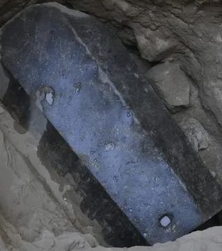 Black, granite sarcophagus measuring around 9 feet long, 5 feet wide and 6 feet tall (2.7 by 1.5 by 1.8 meters)
