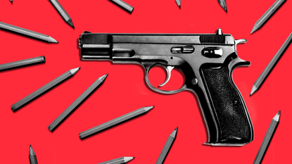 Handgun and pencils on red background