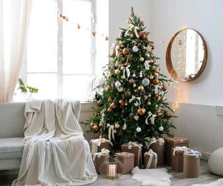 Christmas tree in modern room with neutral color scheme
