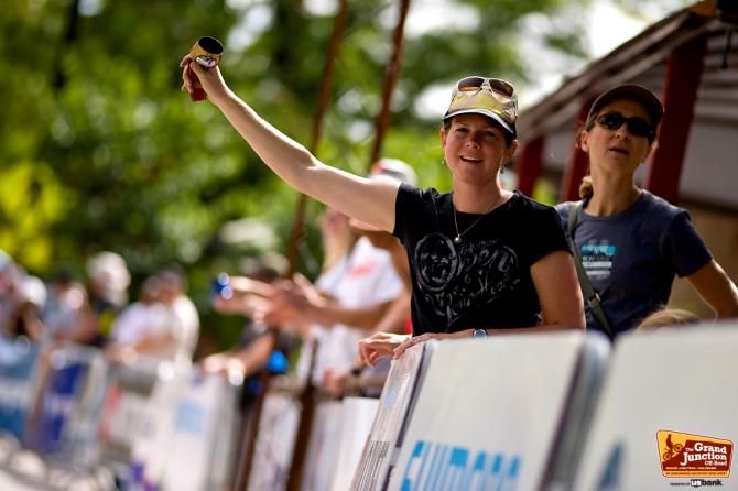 A fan cheers on racers