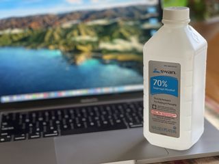 MacBook with rubbing alcohol for cleaning