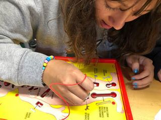 Girl plays Operation