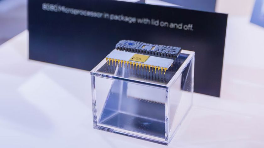 A photo of two Intel 8080 processors, side-by-side, resting on a clear box