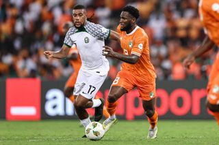 Nigeria AFCON 2023 squad: Ivory Coast's midfielder #8 Franck Kessie (R) fights for the ball with Nigeria's midfielder #17 Alex Iwobi during the Africa Cup of Nations (CAN) 2024 group A football match between Ivory Coast and Nigeria at the Alassane Ouattara Olympic Stadium in Ebimpe, Abidjan, on January 18, 2024. (Photo by FRANCK FIFE / AFP) (Photo by FRANCK FIFE/AFP via Getty Images)