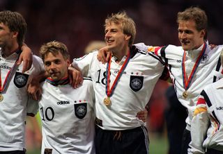 Jurgen Klinsmann (wearing 18) celebrates with his team-mates after Germany's win over the Czech Republic in the final of Euro 96 at Wembley.