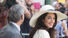 George Clooney and British fiancee, Amal Alamuddin arrive at Venice Town Hall to celebrate their wedding. (Photo by Marco Secchi/Corbis via Getty Images)