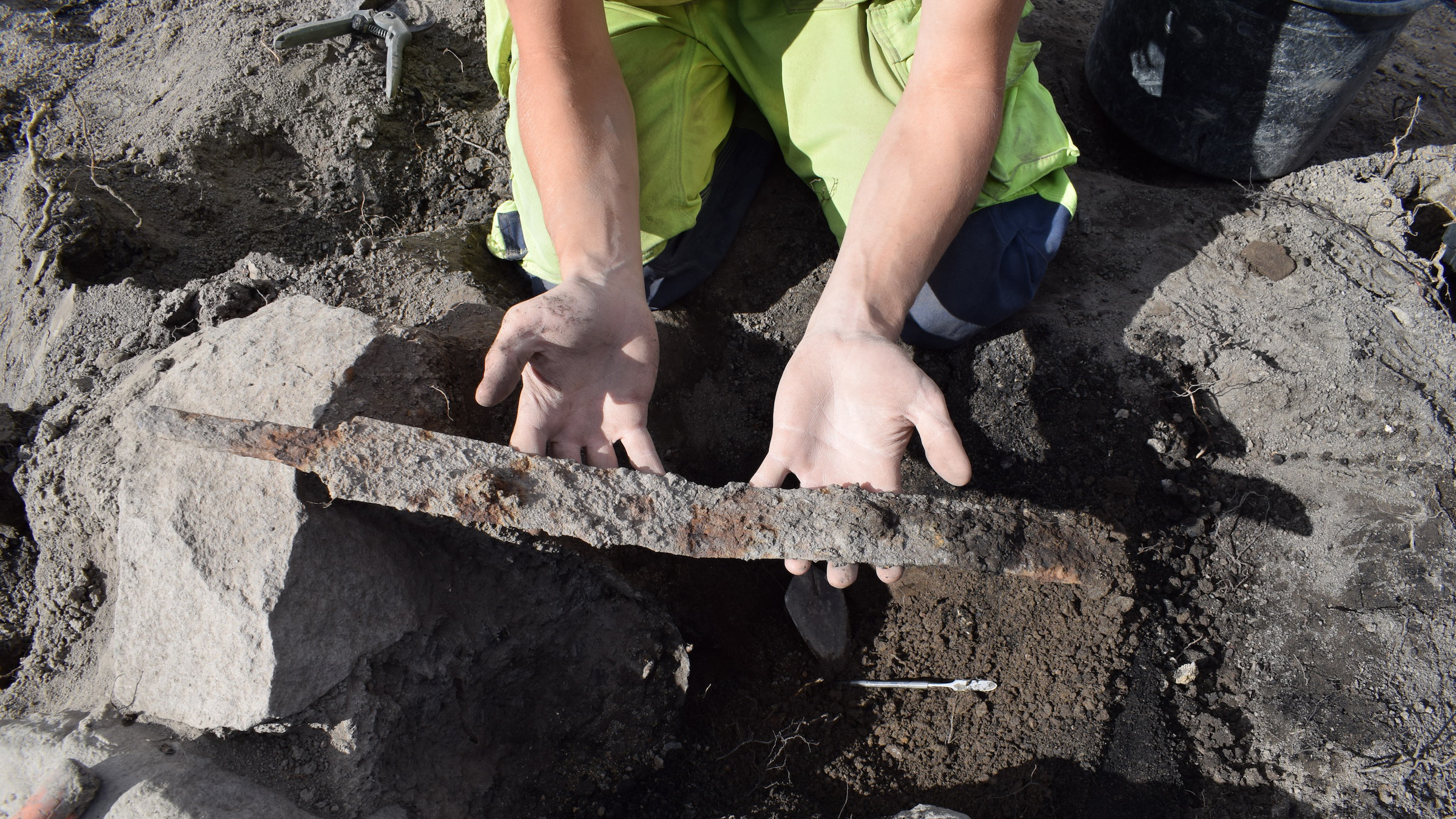 One of the swords is raised after spending centuries in the ground.