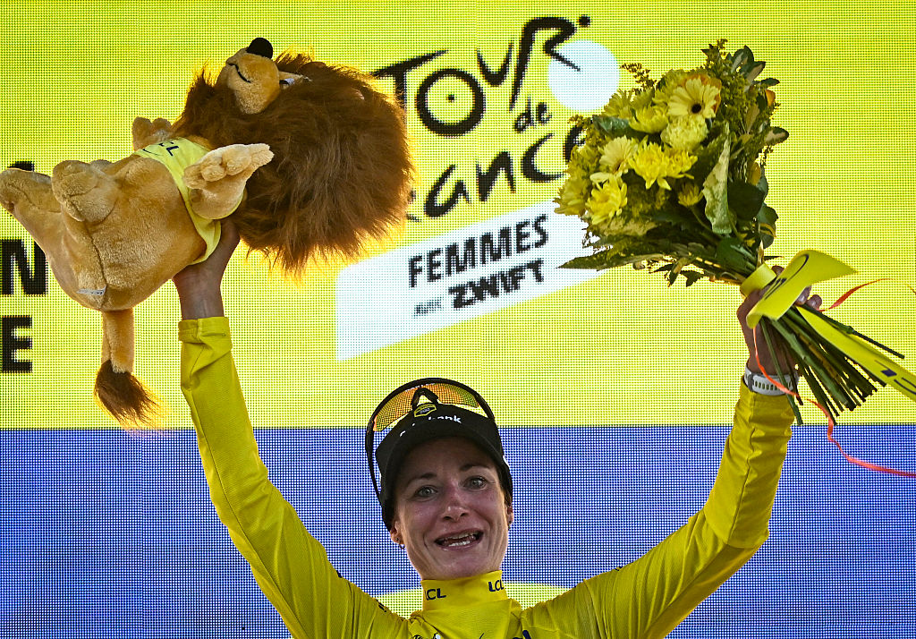 Team Visma | Lease a Bike&#039;s Dutch rider Marianne Vos celebrates on the podium with the overall leader&#039;s yellow jersey after the 1st stage (out of 9) of the fourth edition of the Women&#039;s Tour de France cycling race, 78,8 km from Vannes to Plumelec, in Plumelec, western France, on July 26, 2025. (Photo by JULIEN DE ROSA / AFP)