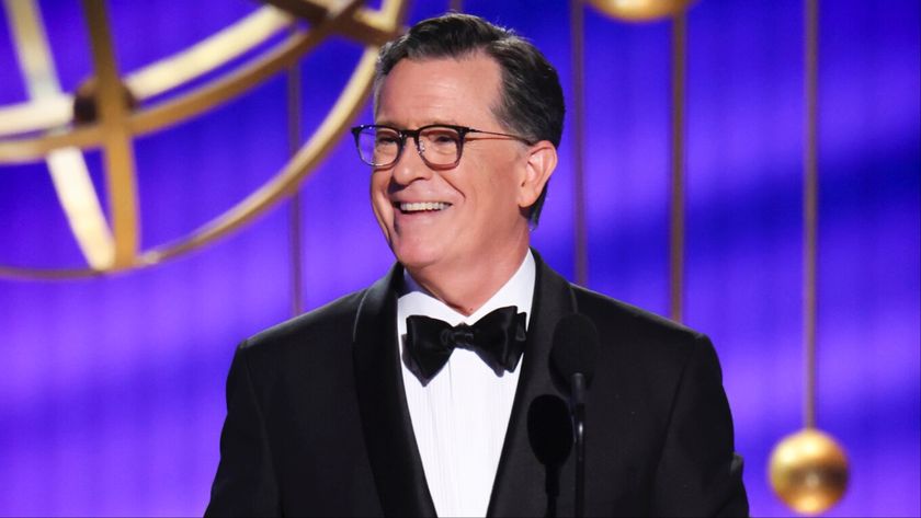 Stephen Colbert presenting an award at the 77th Emmys