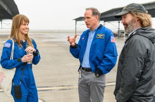 Hilary Swank, as Atlas-1 commander Emma Green, with NASA's Brad Miller and "Away" director David Boyd at Ellington Airport in Houston, Texas in February 2020.