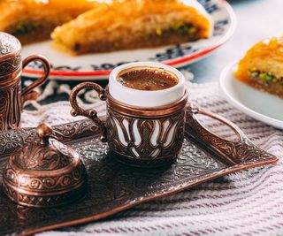 A turkish coffee served with baklava