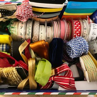 a large collection of colourful ribbon in a box