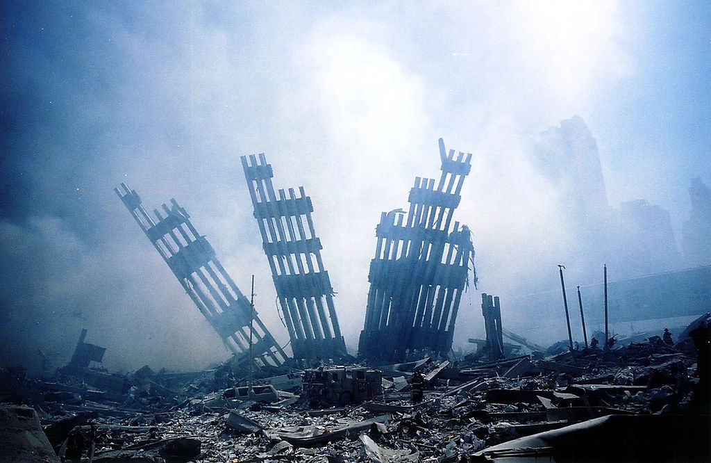 The rubble of the World Trade Center smoulders following a terrorist attack 11 September 2001 in New York