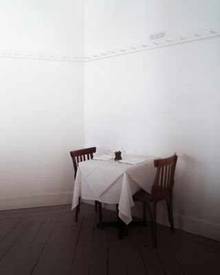 Table for two at Fergus Henderson's restaurant with a white table cloth.