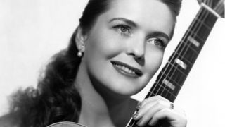 Mary Ford poses for a portrait holding a Les Paul guitar