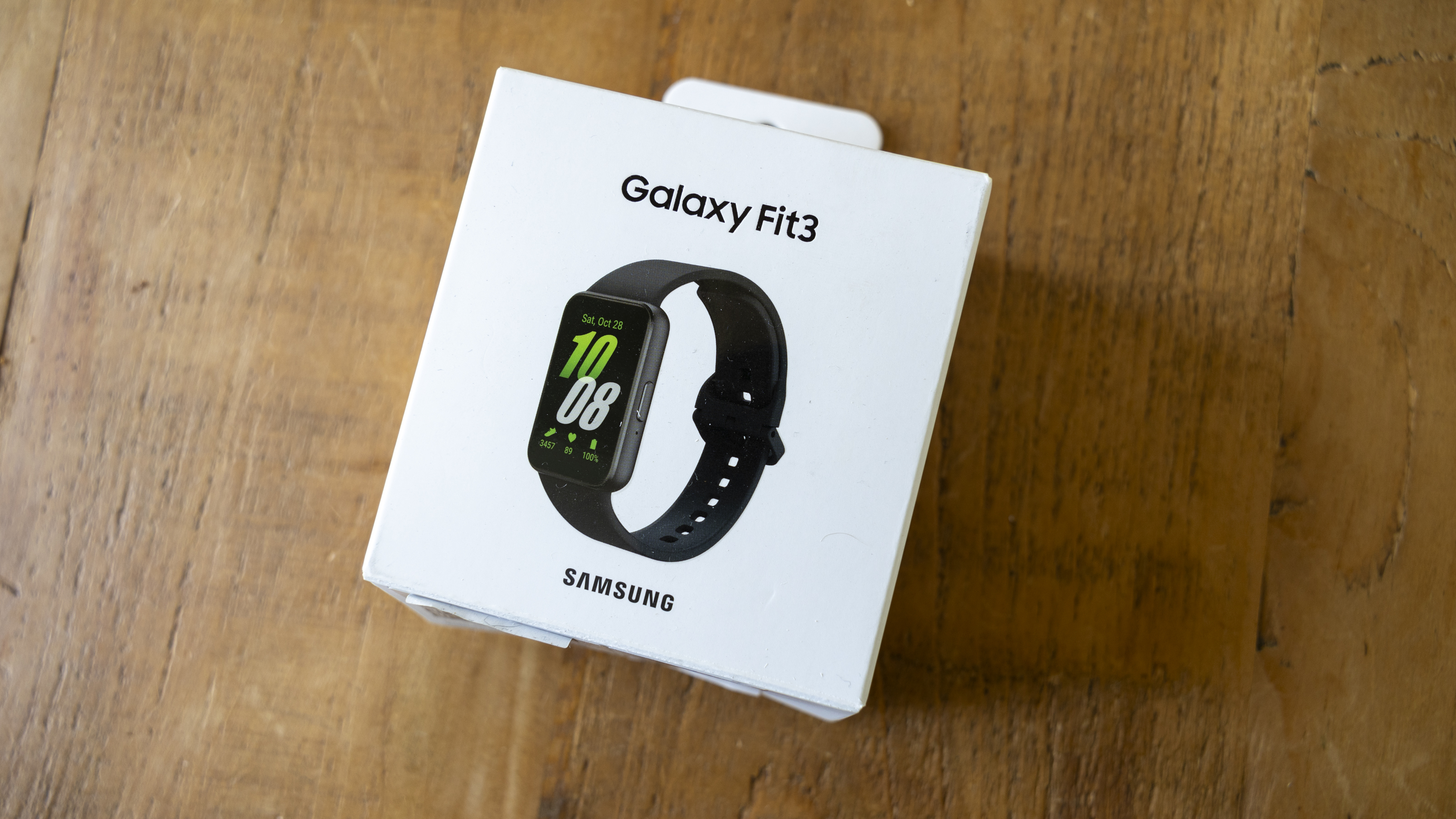 The Samsung Galaxy Fit 3 watch in grey worn on a female wrist