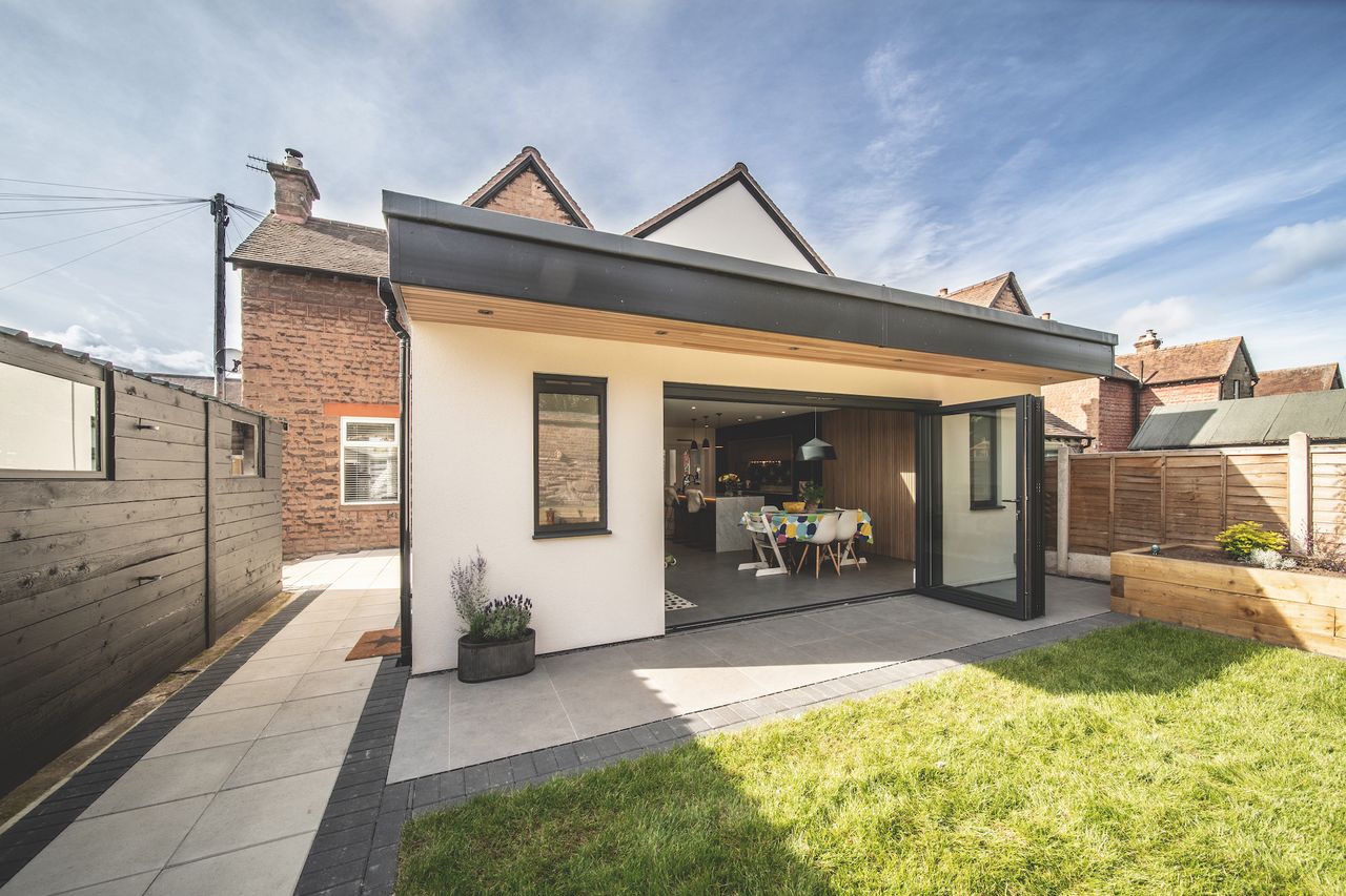 Memories of sitting in the rain with an umbrella as a child prompted Ros to specifically request the overhang outside to recapture the feeling.